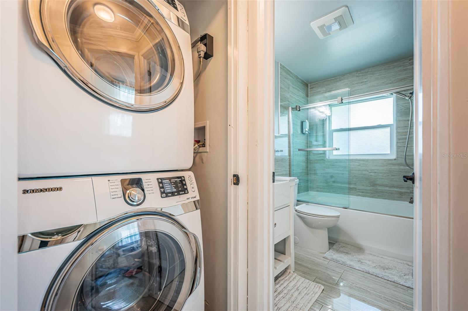 Laundry closet next to bathroom