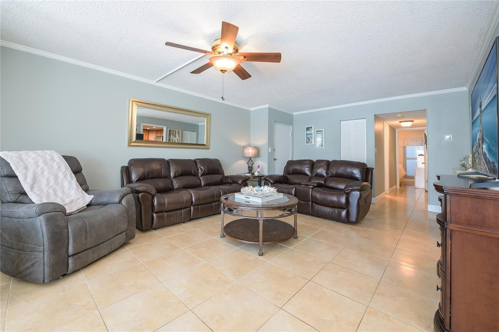 Livingroom large enough to have two sofas and a lazy chair