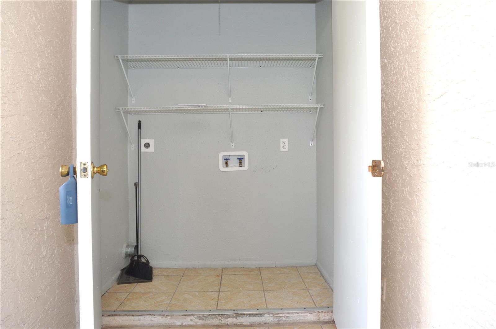 Laundry closet off screened porch