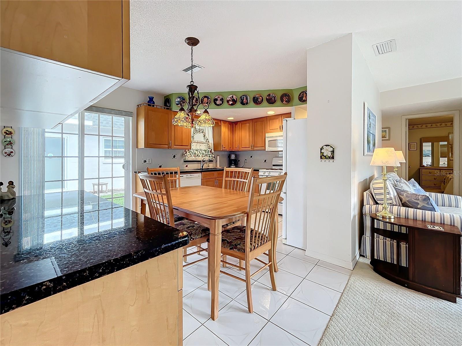 Another view of the kitchen  and living room