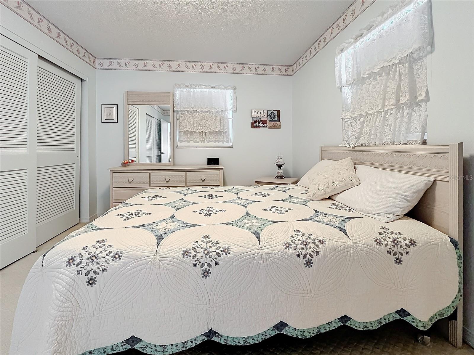 Primary bedroom and whole wall of closets