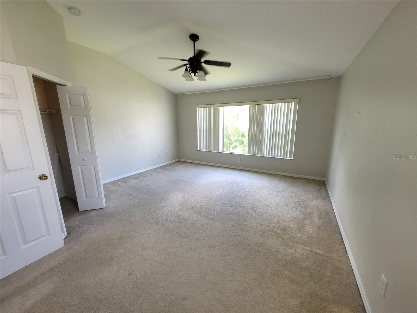 Primary Suite has vaulted ceiling & overlooks wooded preserve