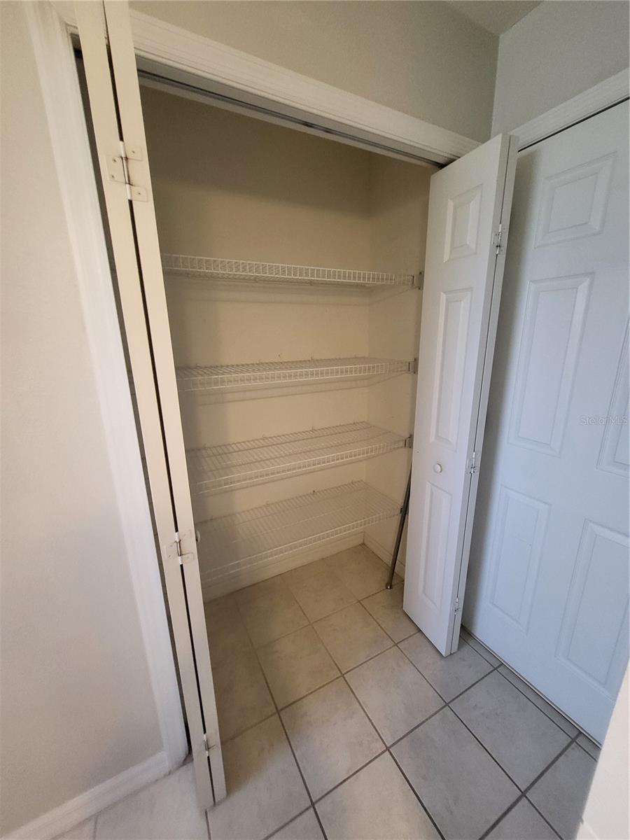 Roomy storage closet in bathroom is great for extra linens & more!