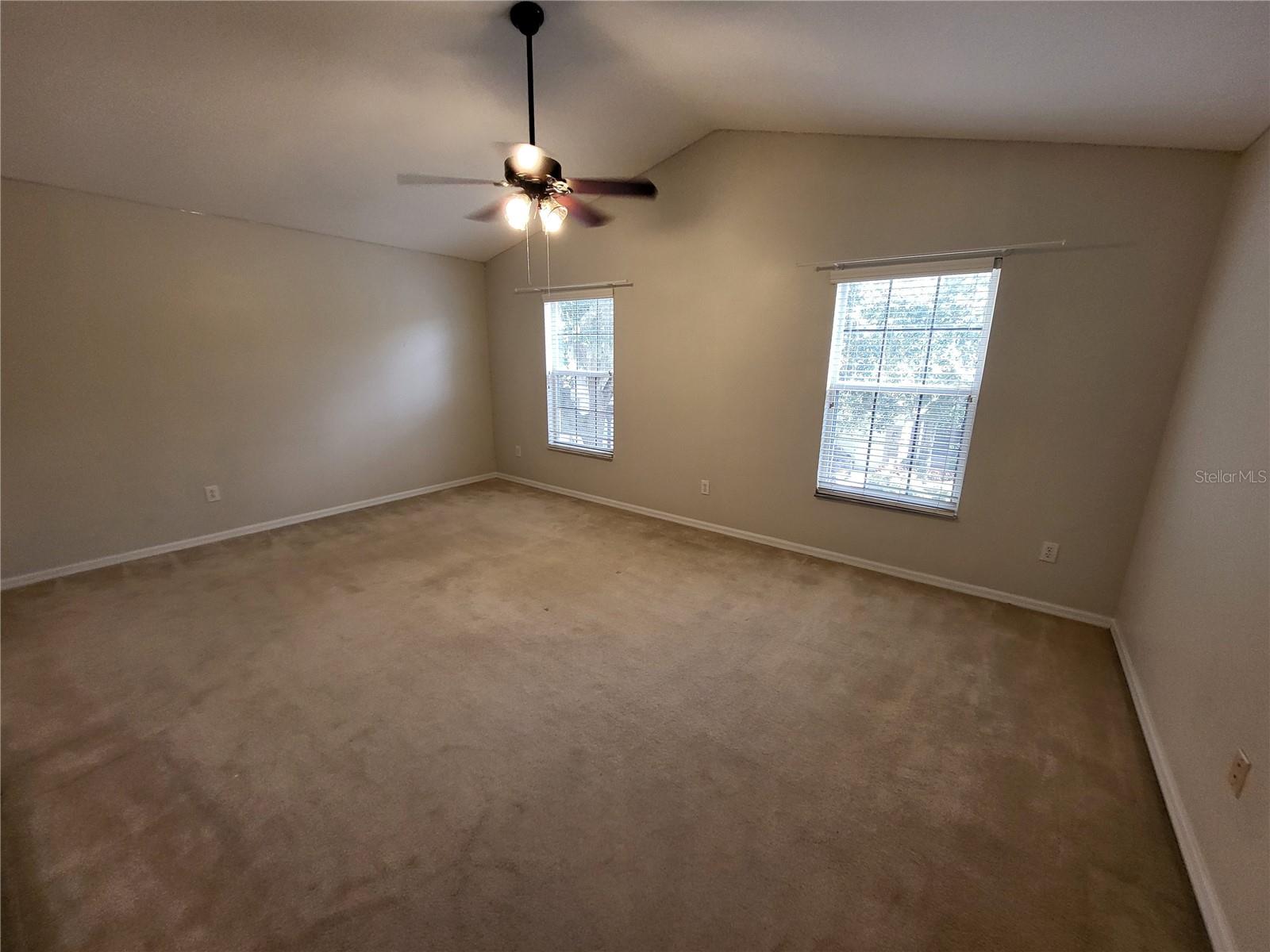 Front bedroom with vaulted ceiling overlooking the front of the home