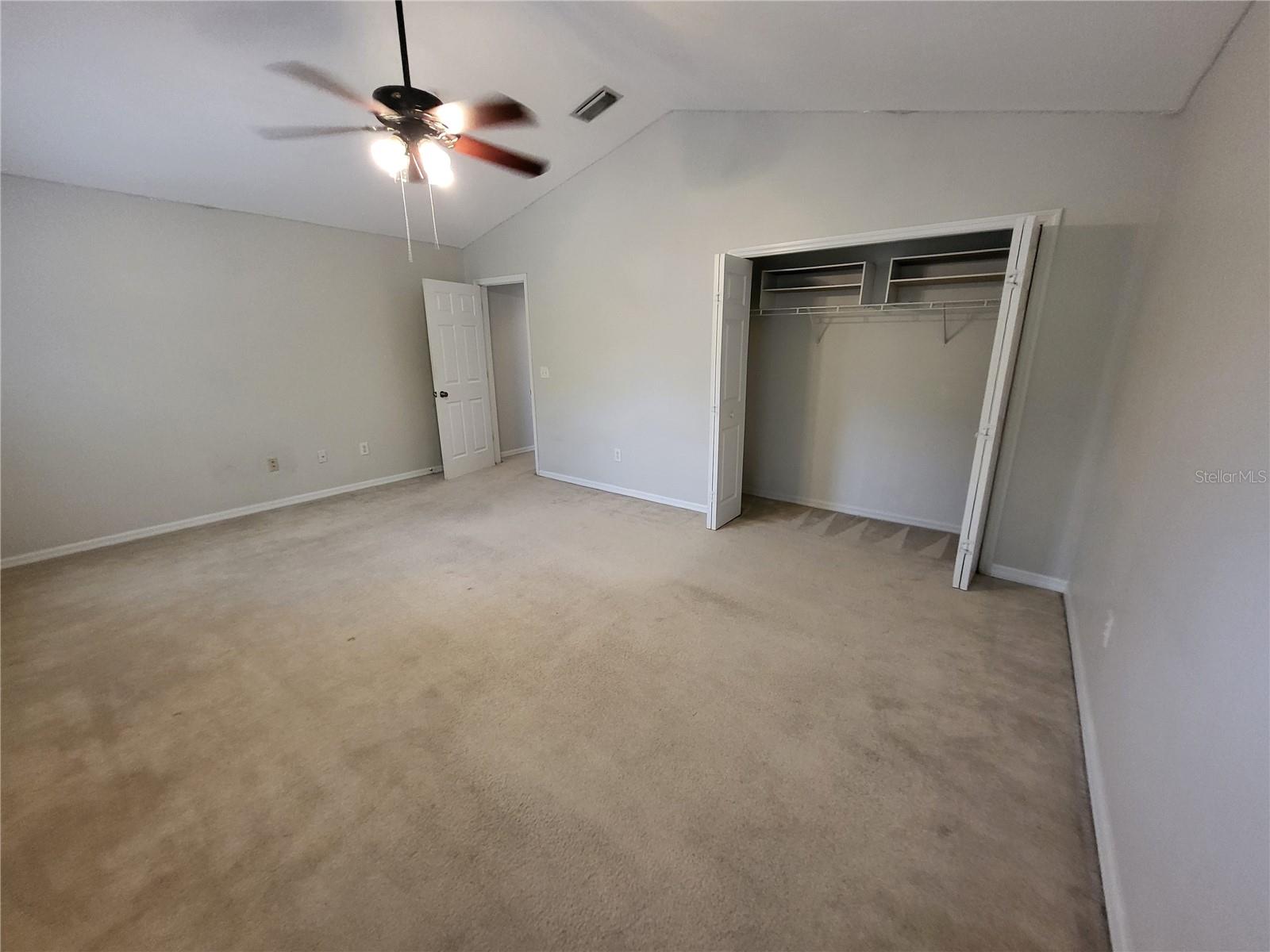 Large built in closet and vaulted ceiling