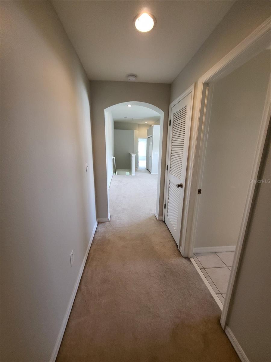 Hallway from front bedroom to bonus area and back of unit.  Plenty of privacy between bedrooms