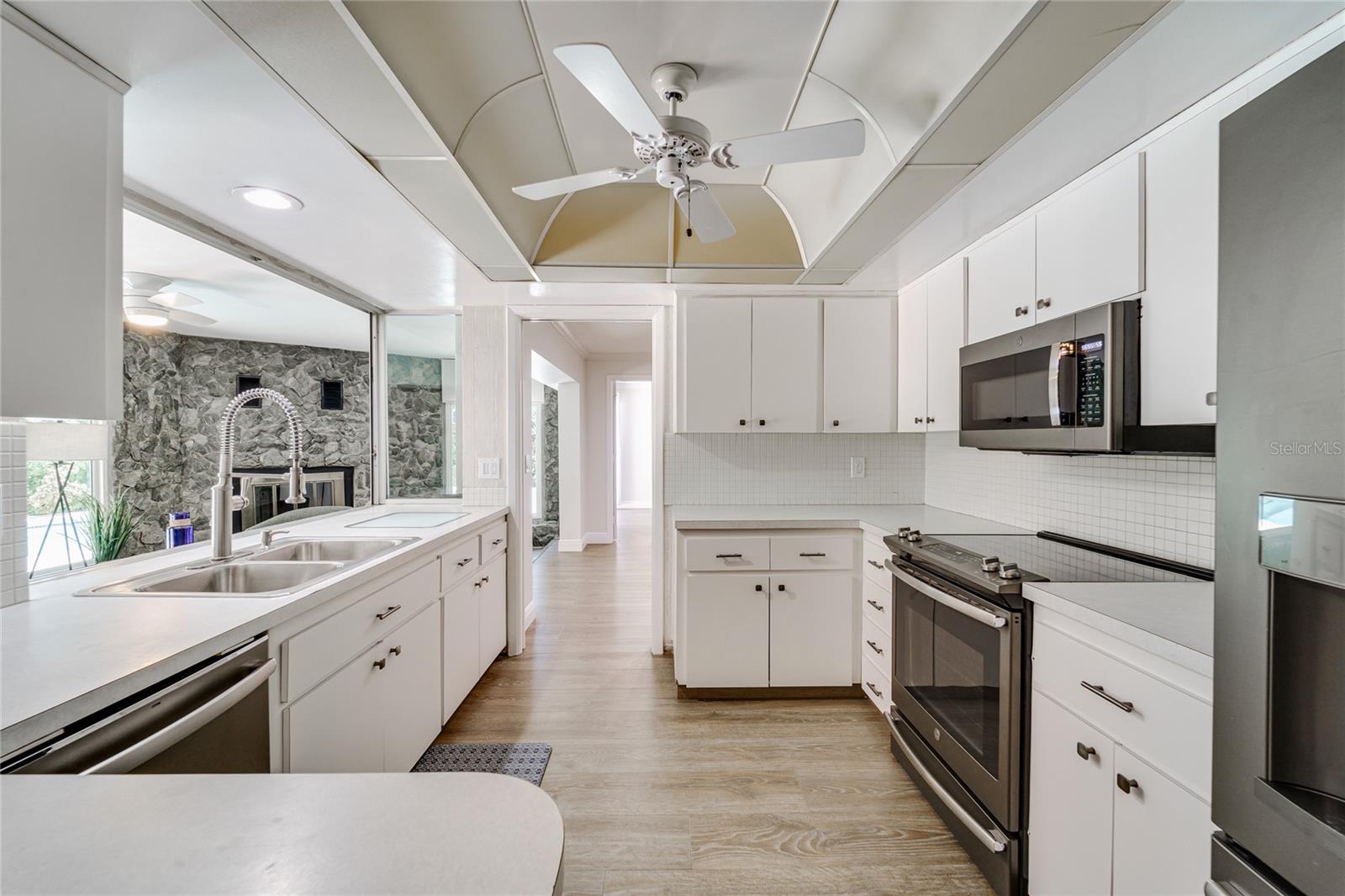 The kitchen is the anchor of this home. Newer stainless appliances make it comfortable, awaiting your plans for the kitchen of your dreams!