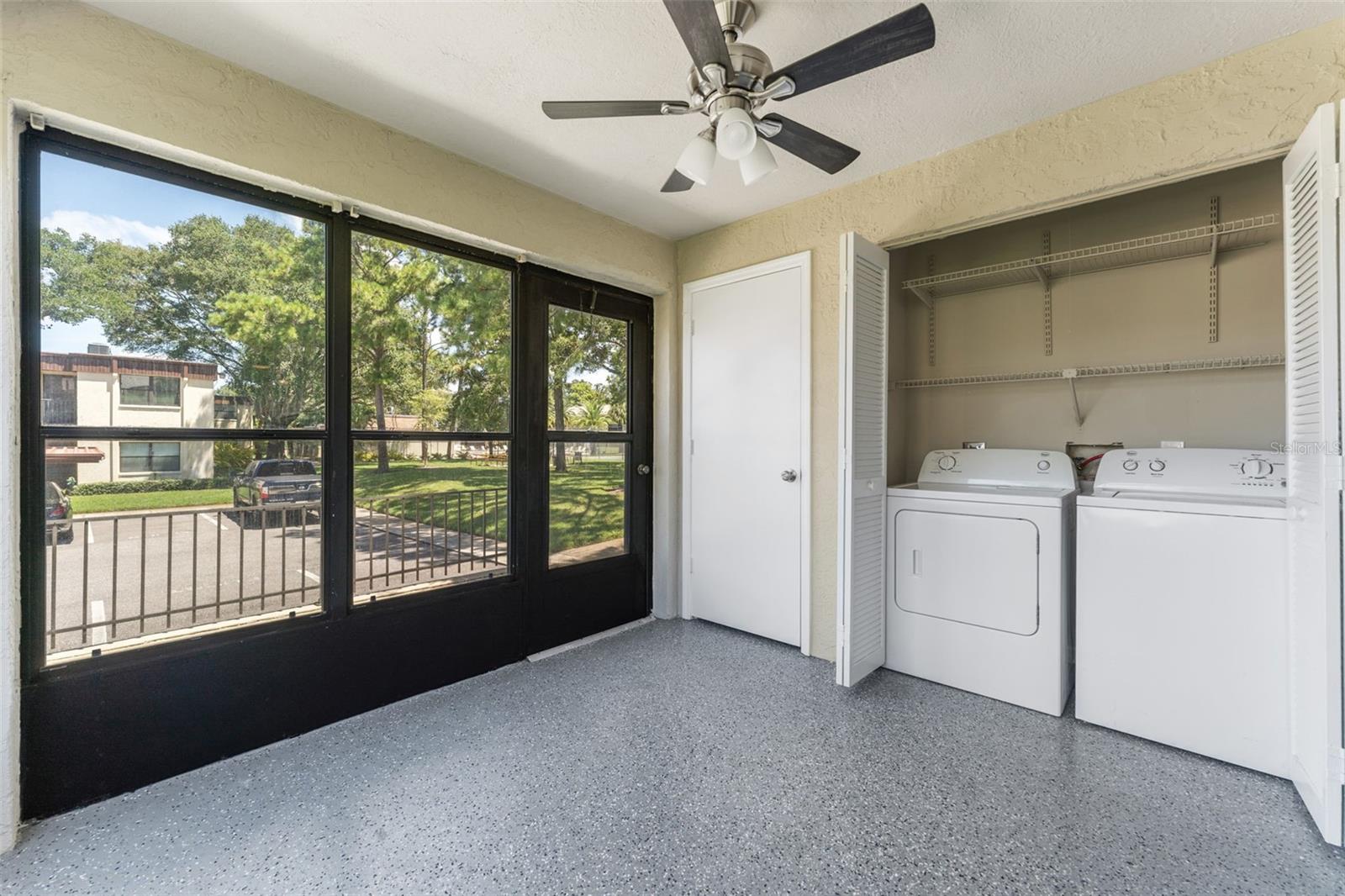 Laundry room in enclosed porch