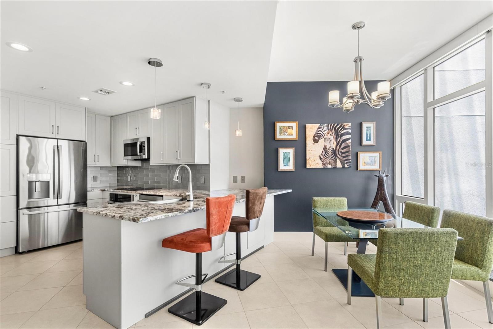 This efficient floor plan has a wonderful open flow between the kitchen, bar, dining and living room, allowing every square inch used efficiently.