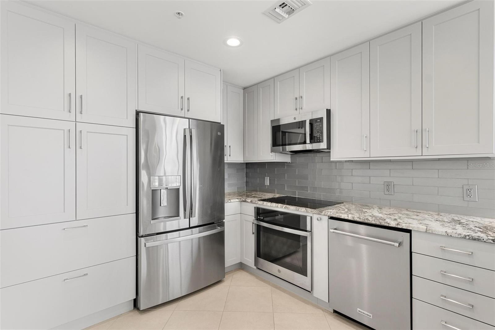 You'll be "wowed" by this COMPLETE kitchen renovation with high end appliances and designer touches throughout.