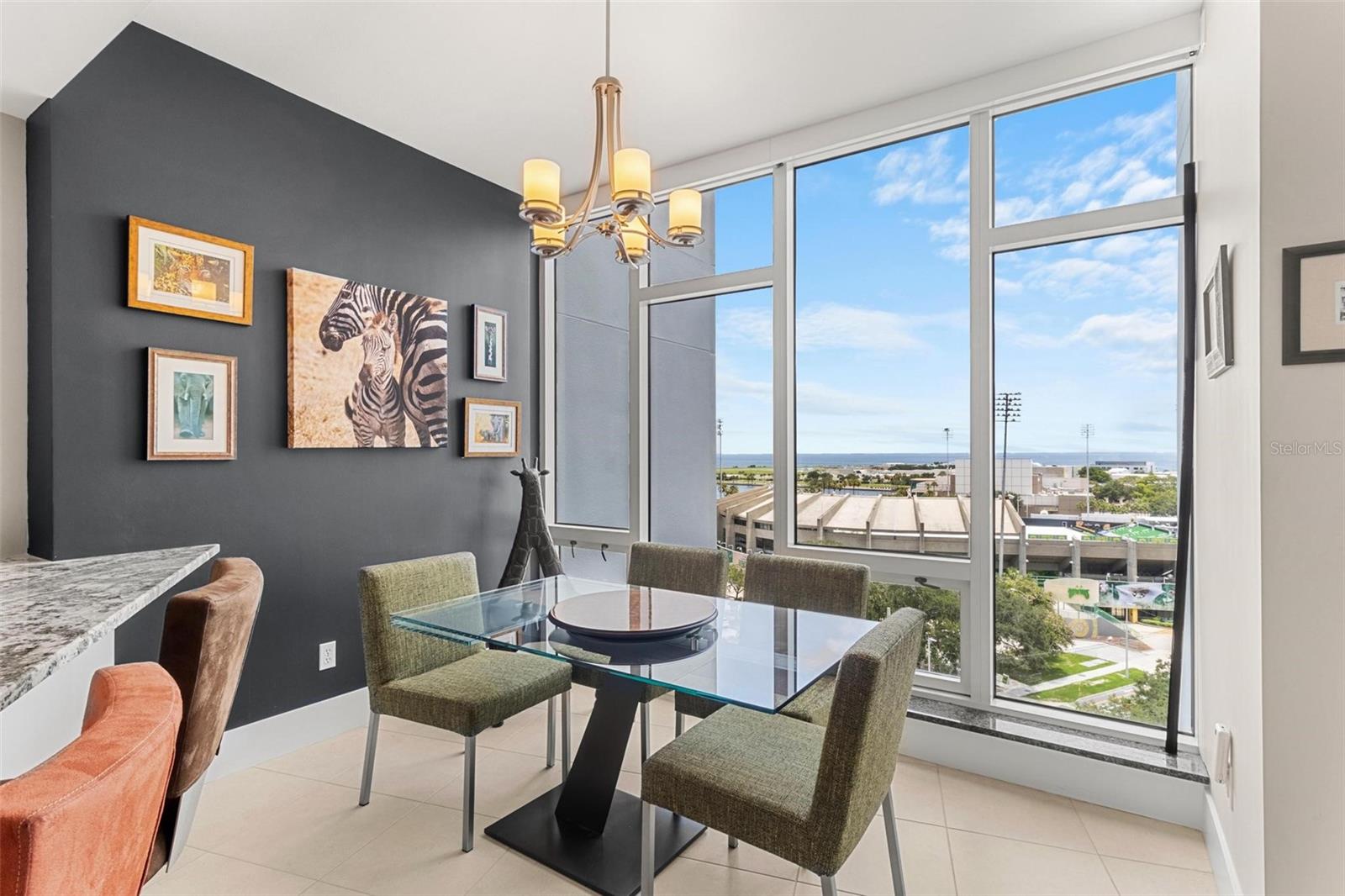 Dining area features floor to ceiling windows with pretty amazing views, day & night!