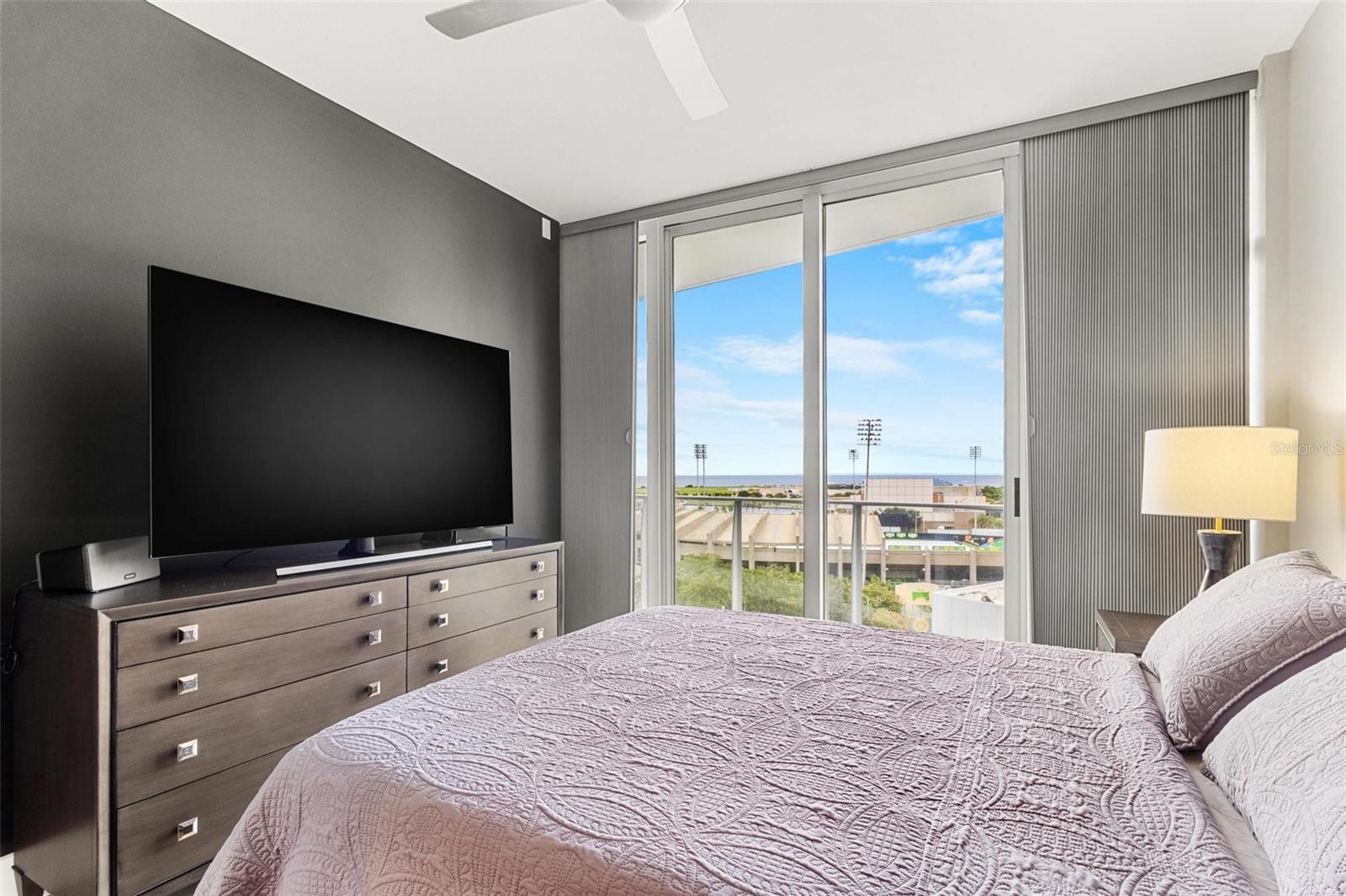 Primary bedroom is spacious enough for king sized bed with plenty of room for additional furniture... and look at that view!