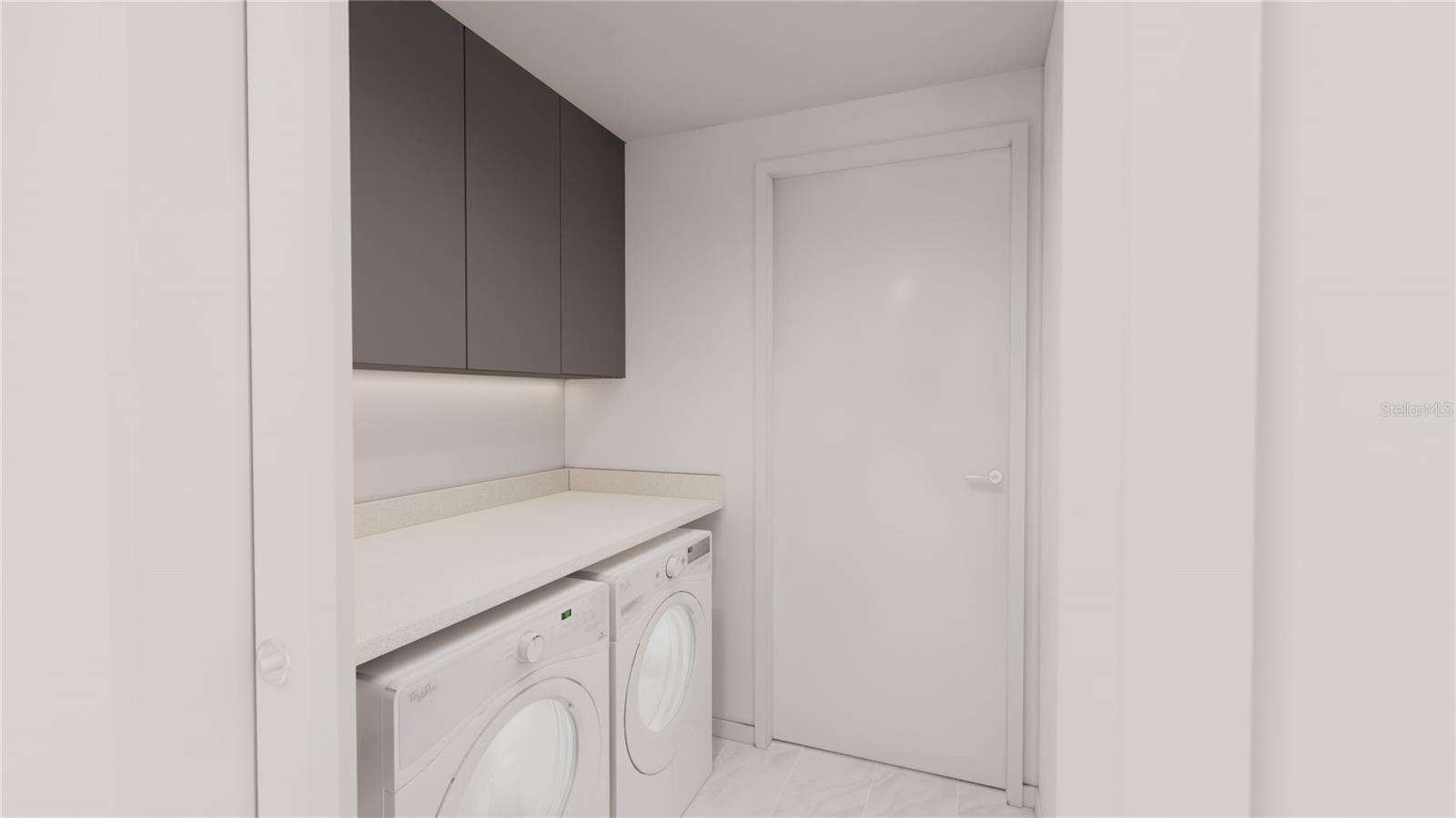 Laundry room with undercabinet lighting, quartz countertops, full size Whirlpool washer and dryer