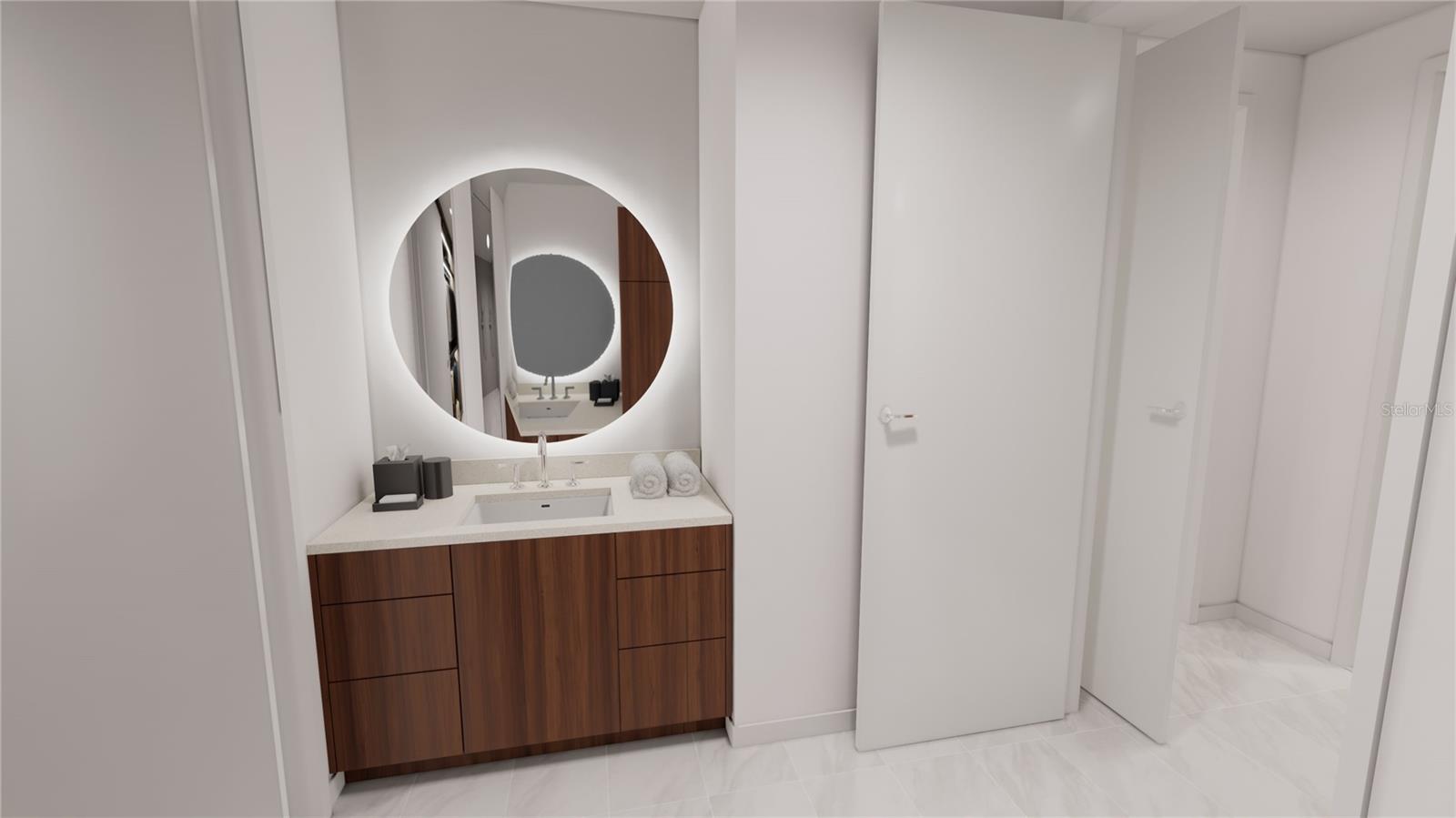 Second vanity with backlit mirror in the primary ensuite