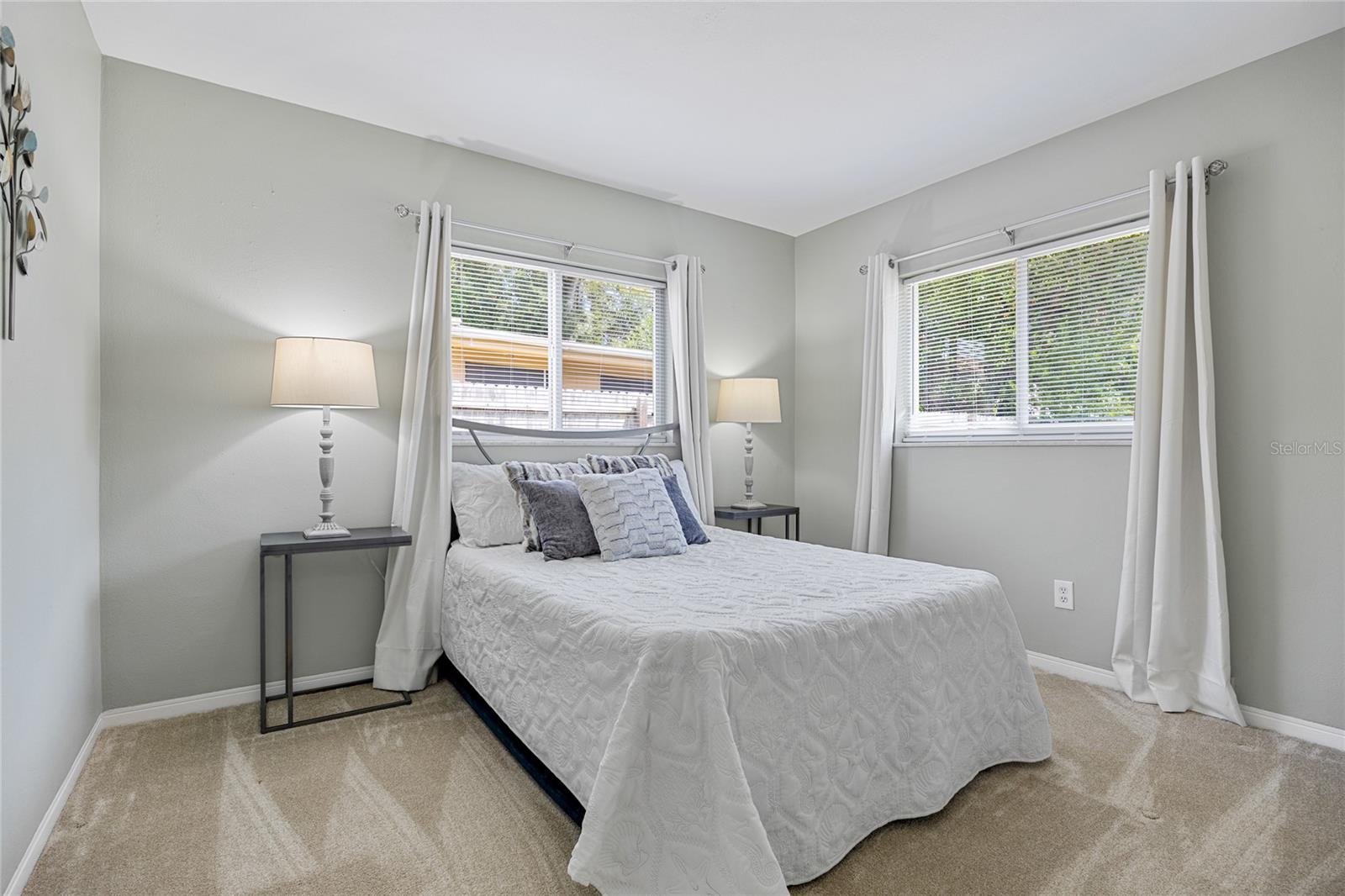 Bedroom #2 Has windows on 2 walls and brand new carpet.