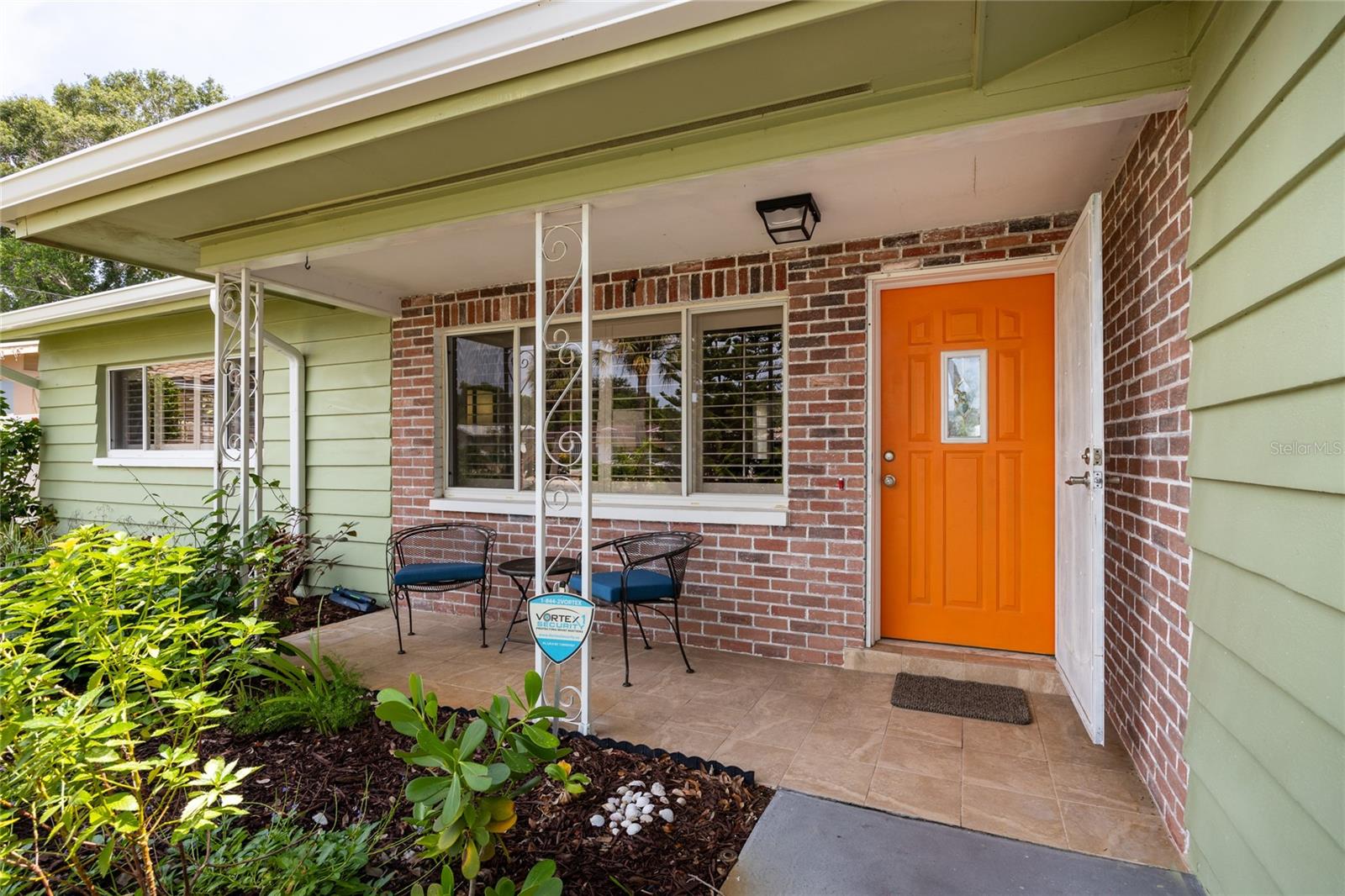 A charming front porch welcomes you in!