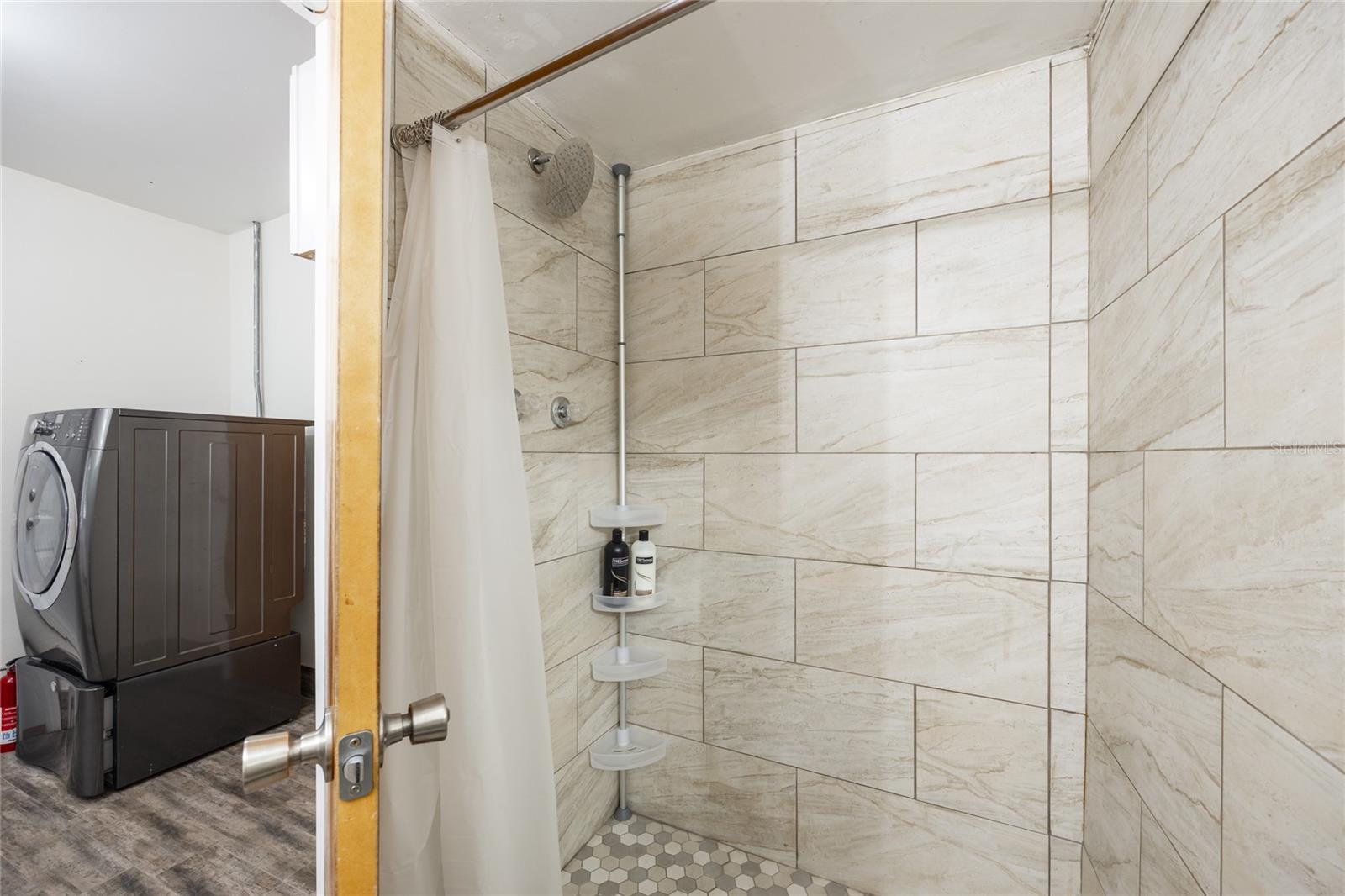 Bathroom #2 has a fully tiled shower stall.