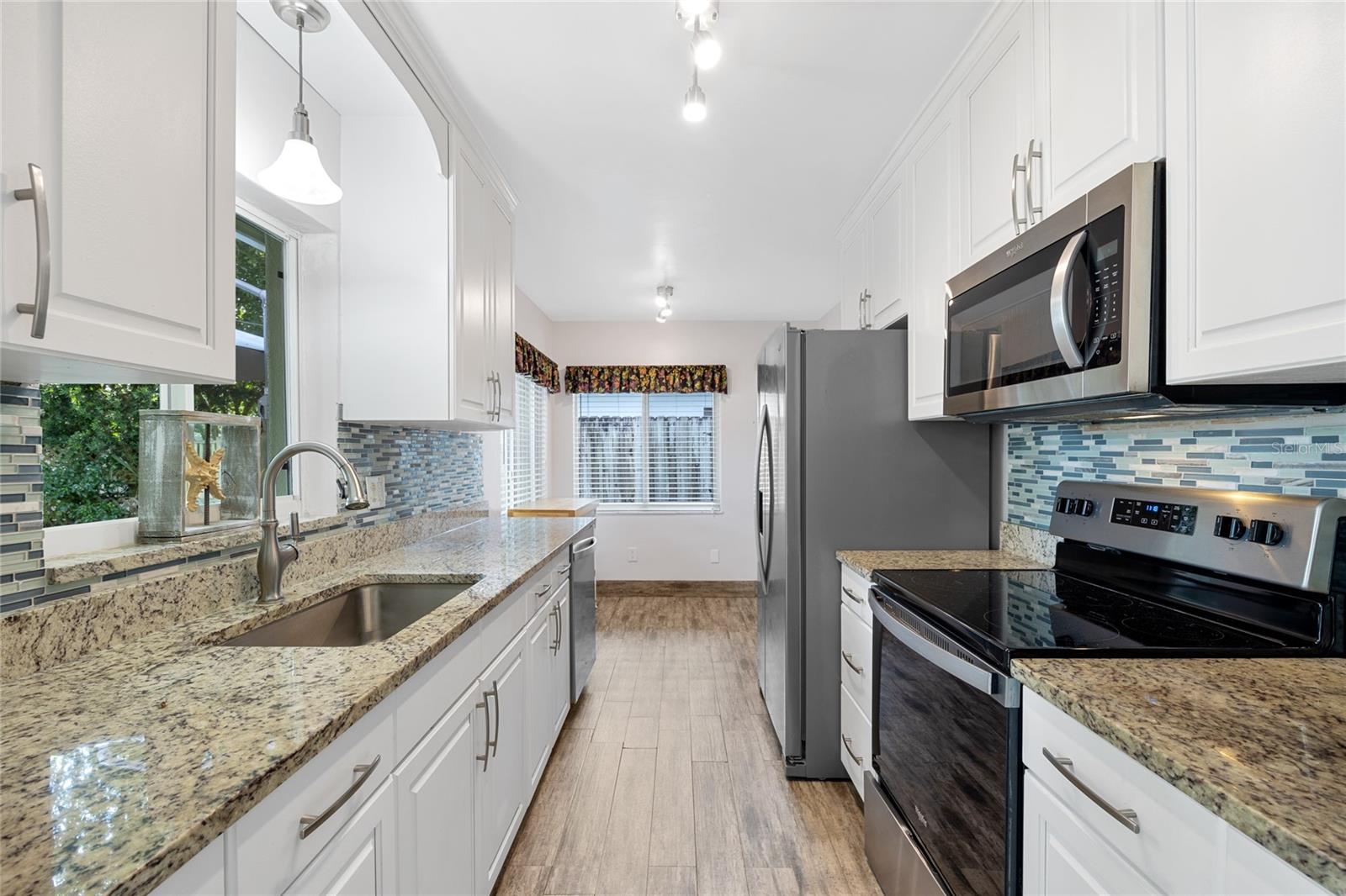 The fully updated Kitchen has granite counters and stainless steel appliances.