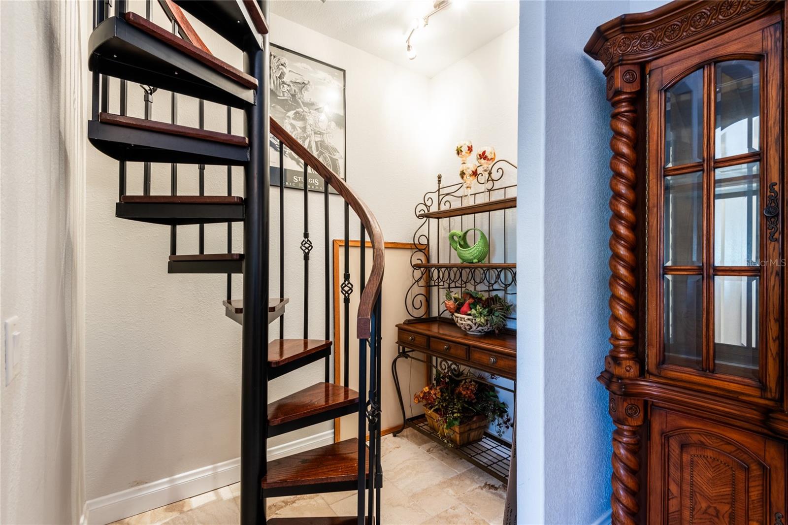 Custom spiral staircase leads to Bonus room/play room/study