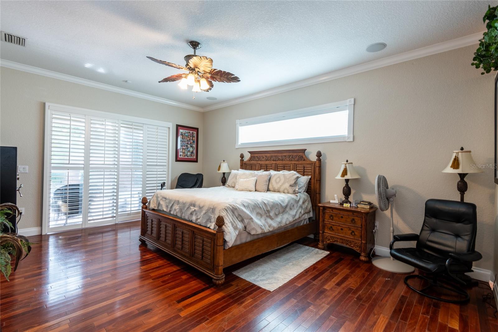 Master bedroom with sliding glass doors to the pool/spa