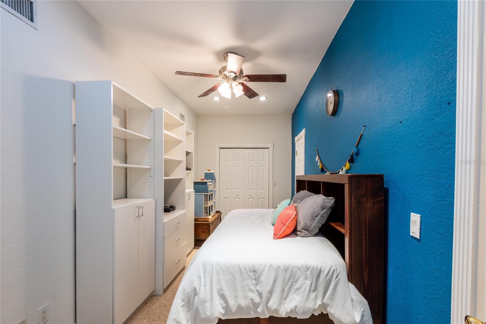 Spiral staircase leads to the Bonus Room with closet