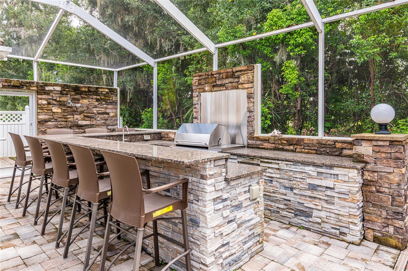 Another view of the Bar-B-Q area with gate to the side yard.