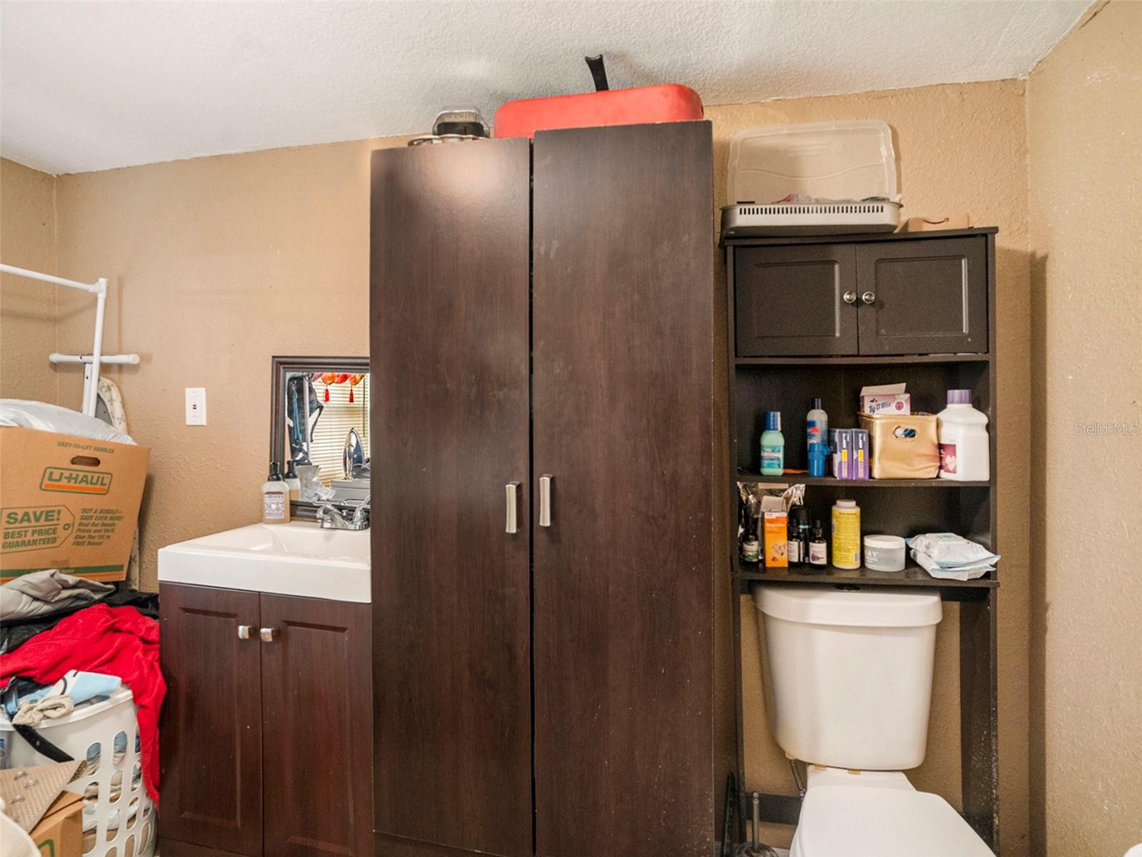 Laundry room/half bath. APPROX 6.8 x 9.1