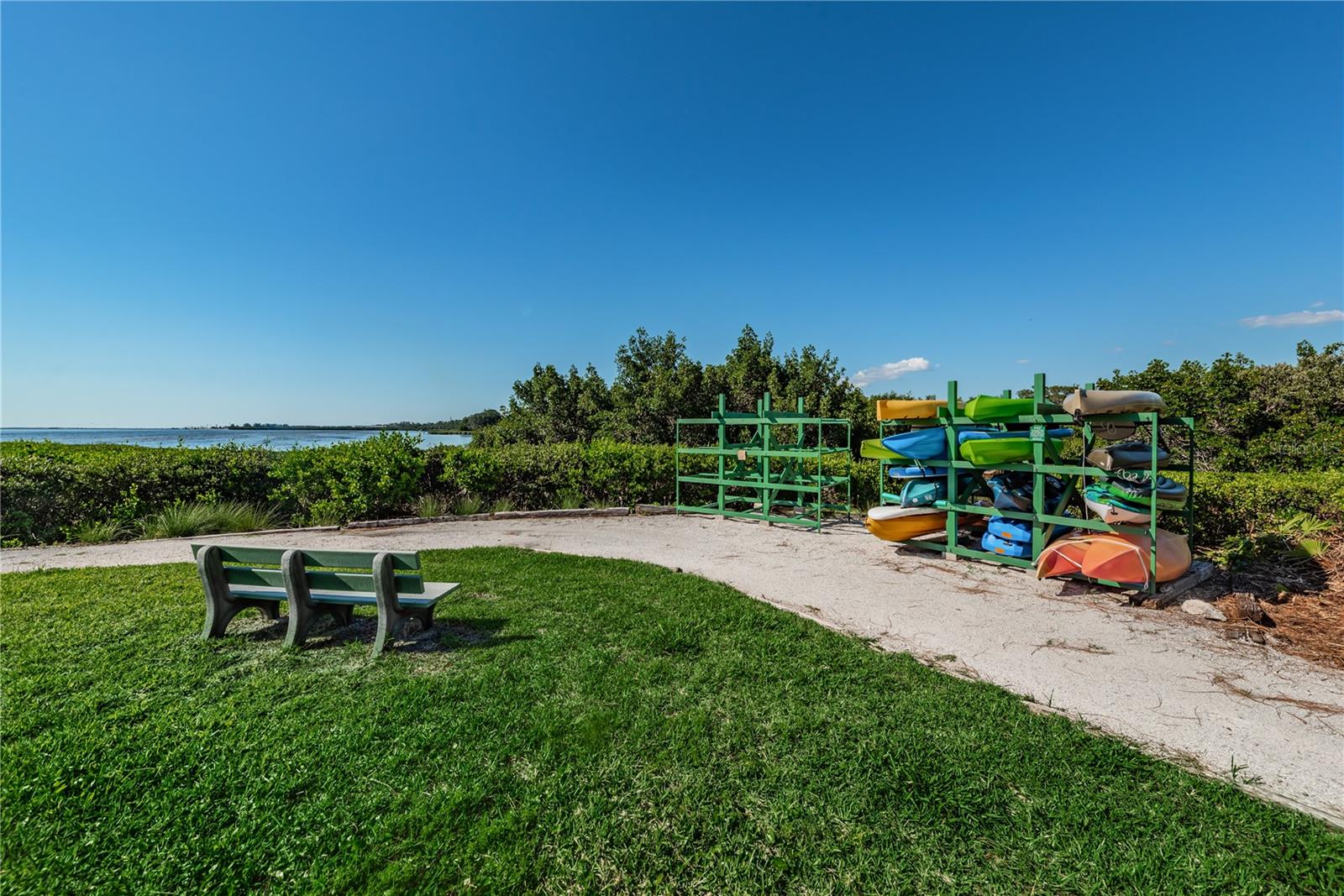 Community kayak launch to the calm shallow waters of the surrounding gulf.