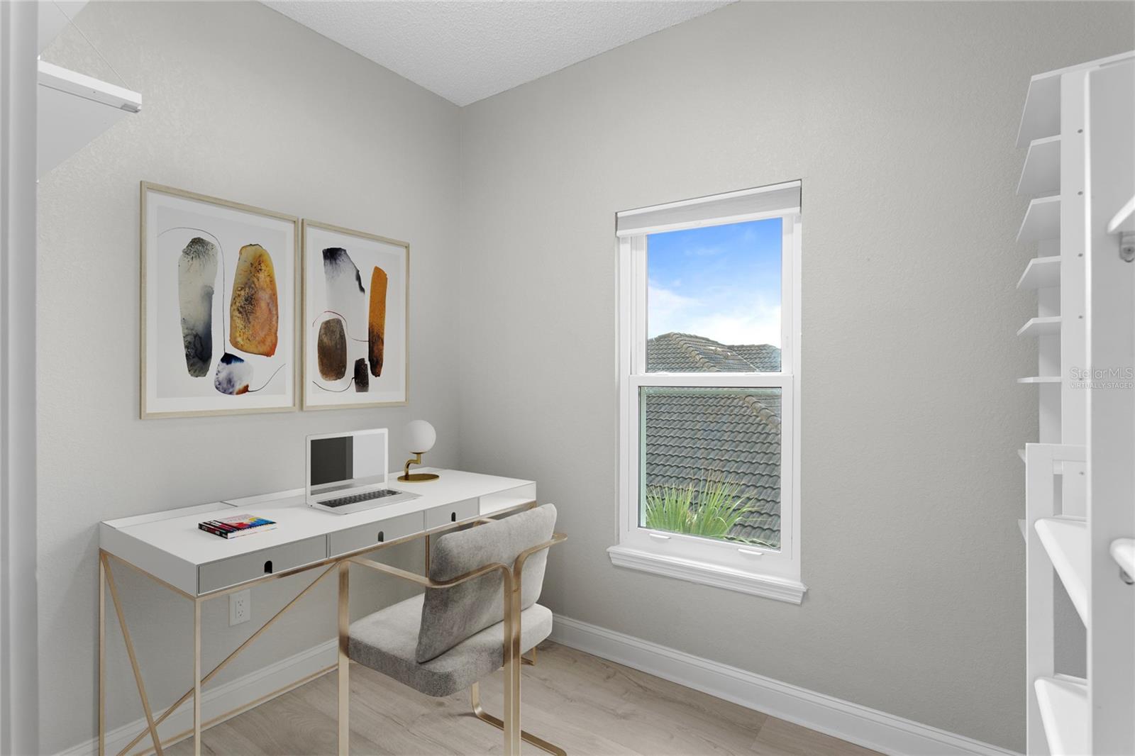 Virtually staged image of bonus room that would make a great space for an at home office