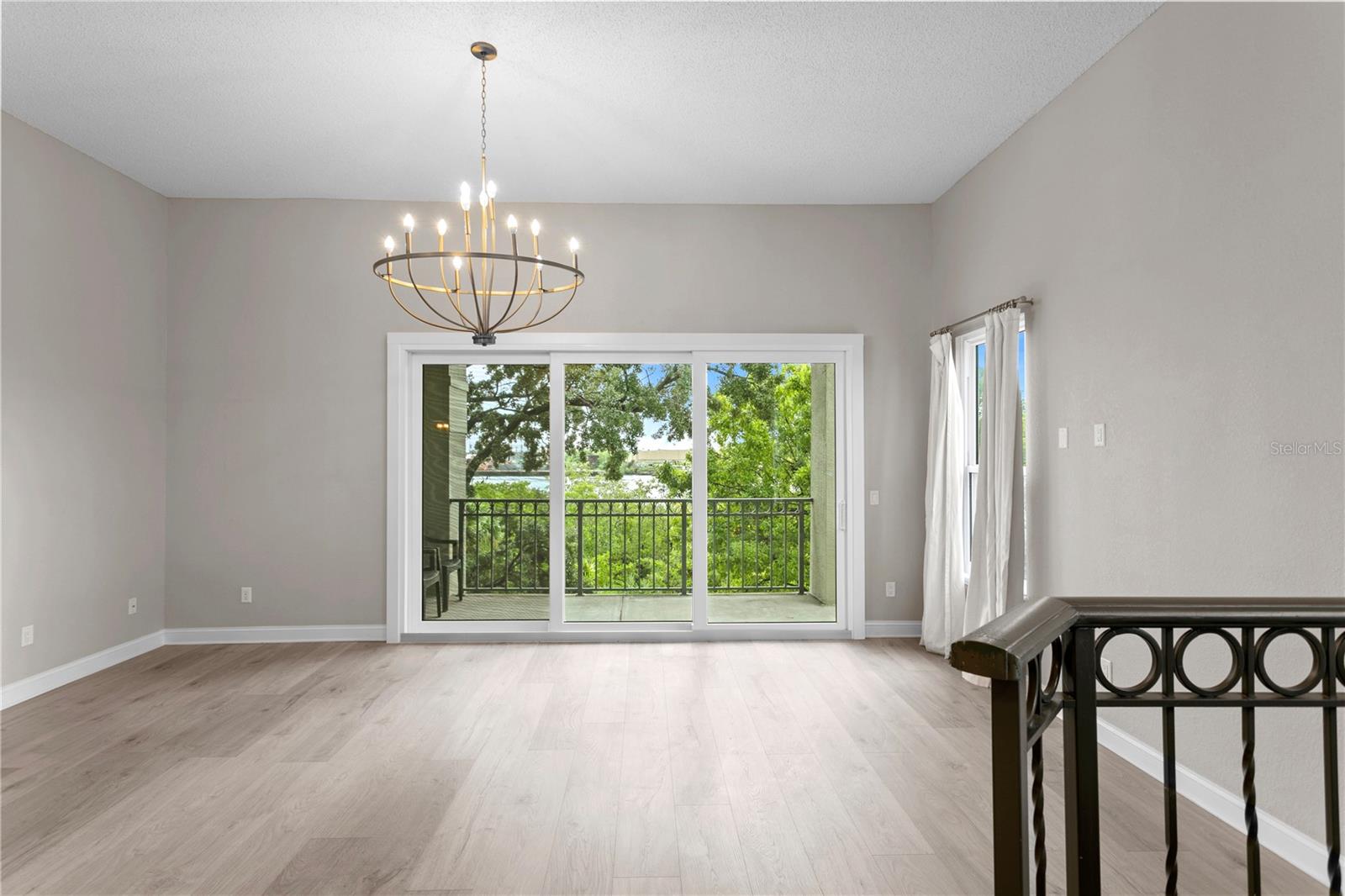 10+ Foot Ceilings --At the top of the steps, you enter the living room with great natural light and balcony overlooking the Sparkman Channel