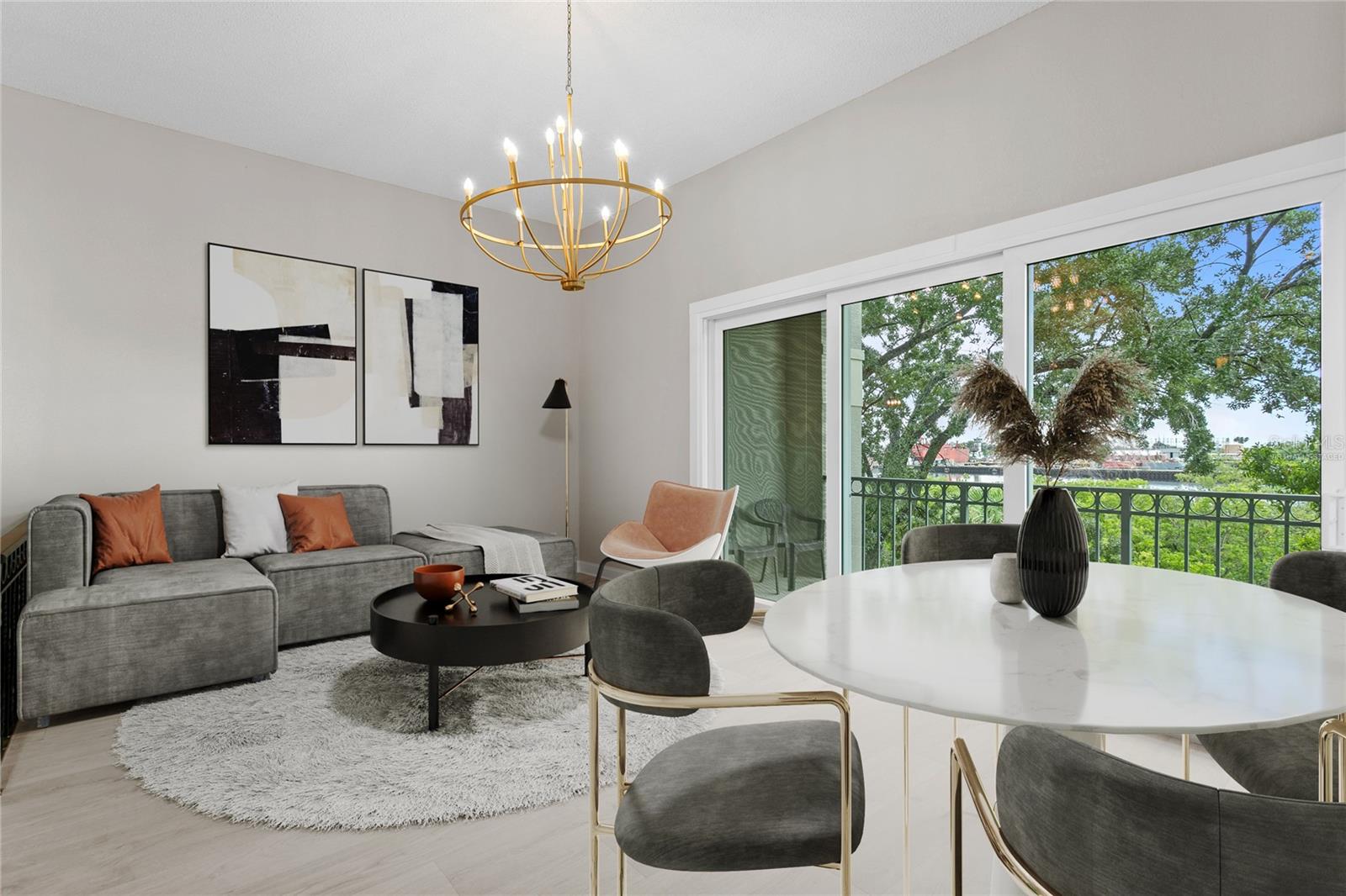 Virtually staged image of the living room with balcony overlooking cargo ships that pass through the Sparkman Channel