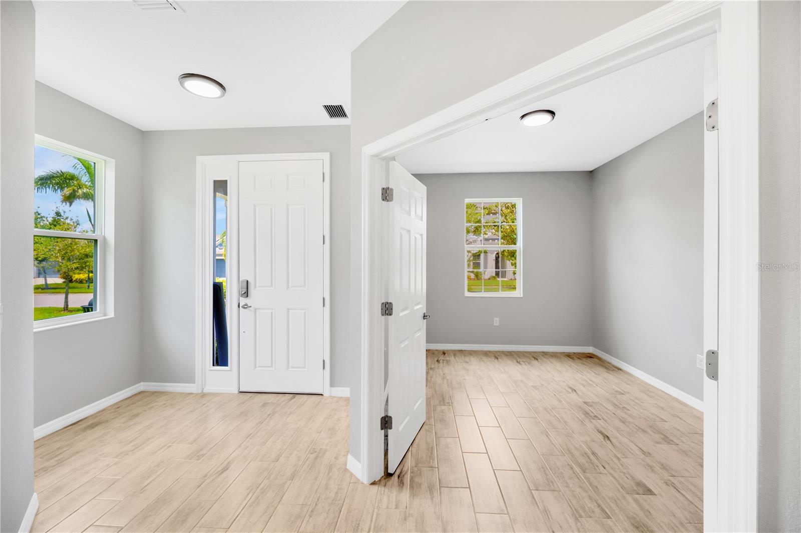 Front entry and home office with tons of natural light!