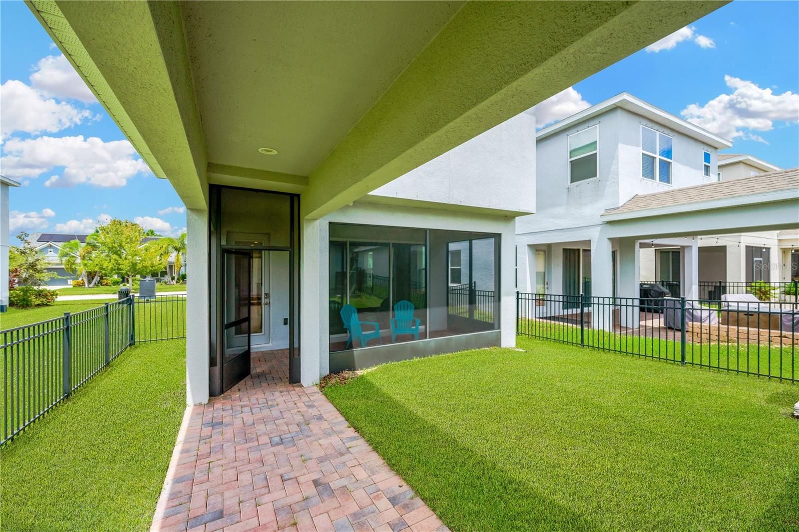 Covered breezeway from the spacious garage to the house