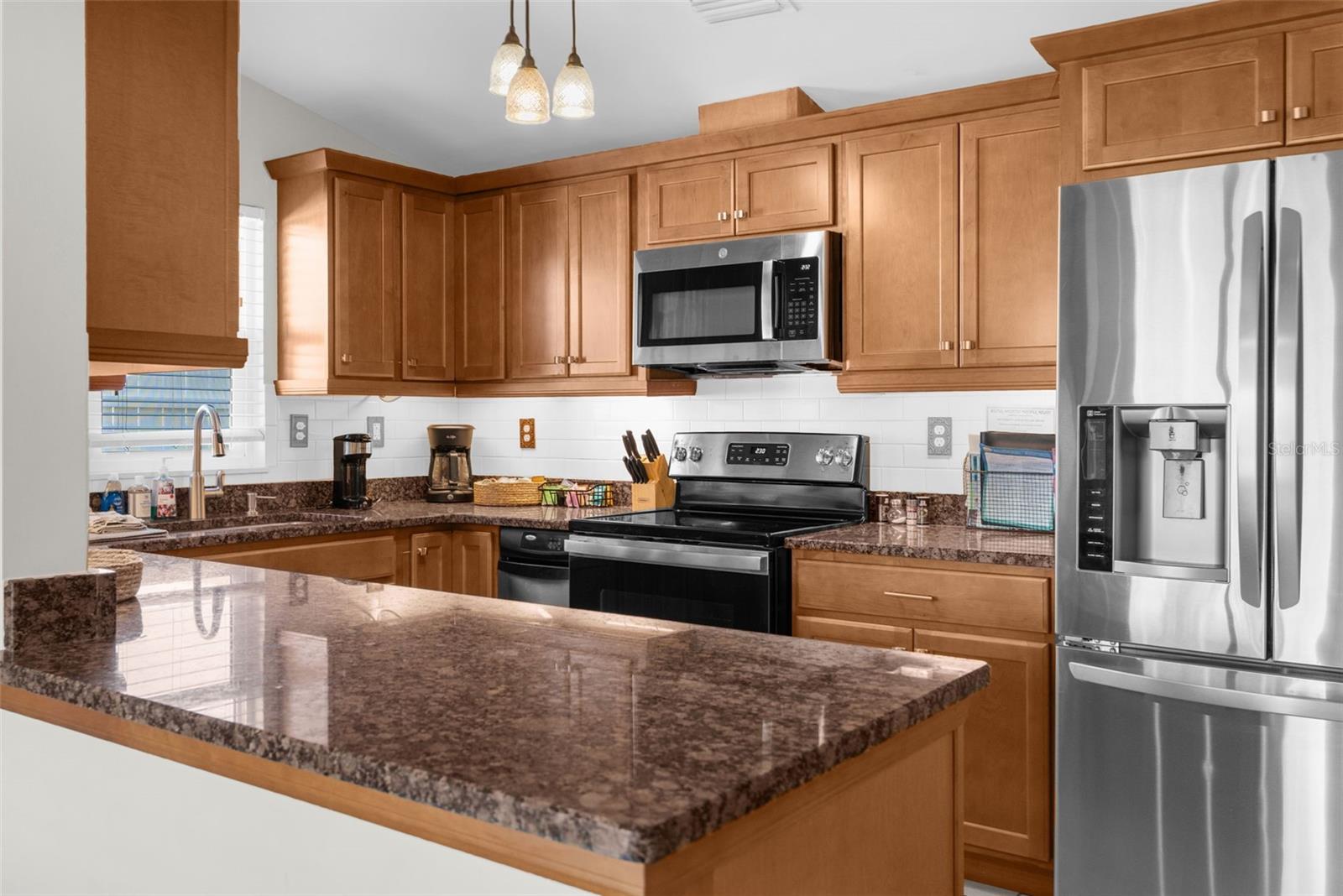 Updated Kitchen with Wood Cabinets, Granite Counters & SS Appliances