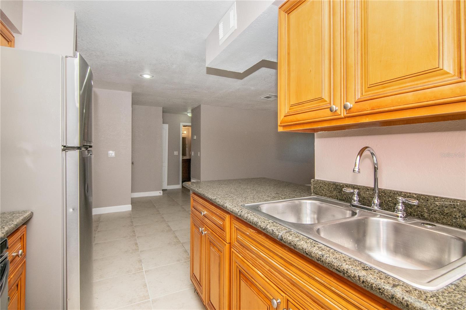 Kitchen w/ Wood Cabinets, Granite Counter-Tops, Stainless Steel Appliance Package