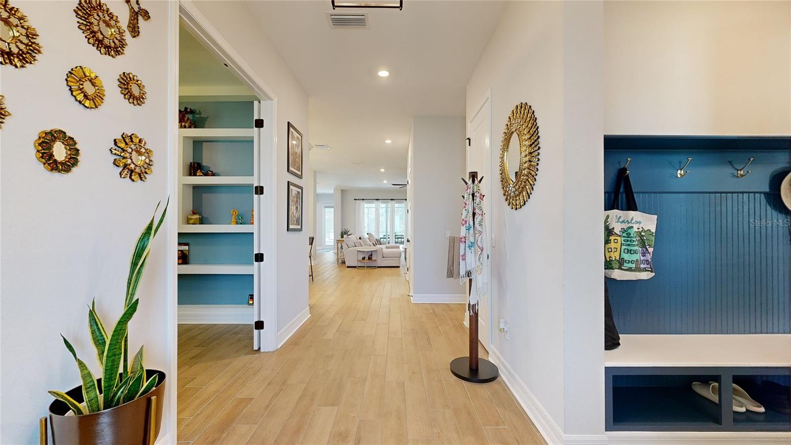 Entryway. Mudroom on the right, guest bedroom 1 and office on the left.