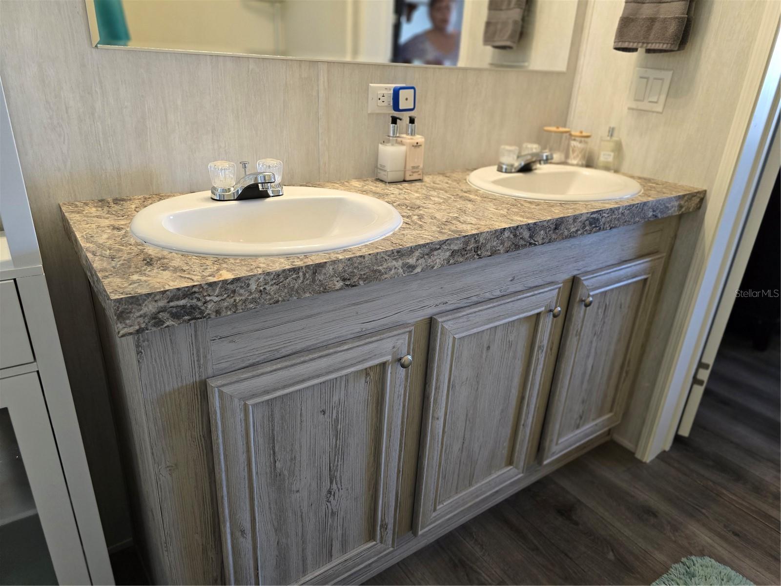 Primary bathroom boasts a double sink vanity