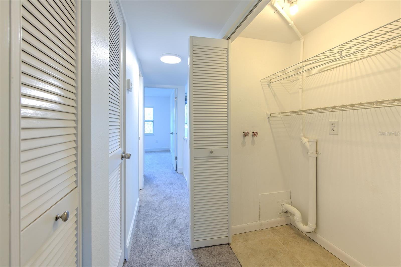 Upstairs laundry closet with washer/dryer connections