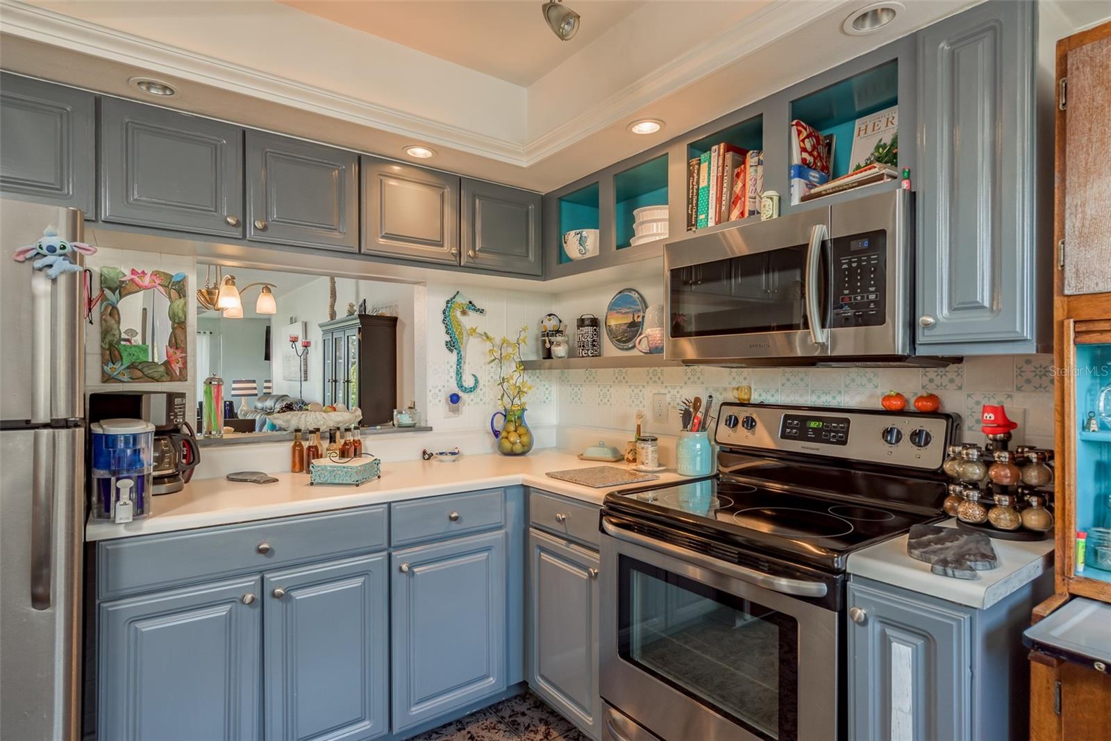 The kitchen has a passthrough to the dining room