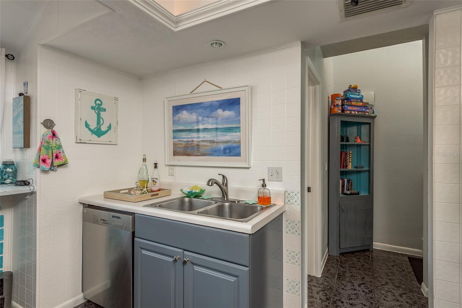 Kitchen sink and hallway to upper floor