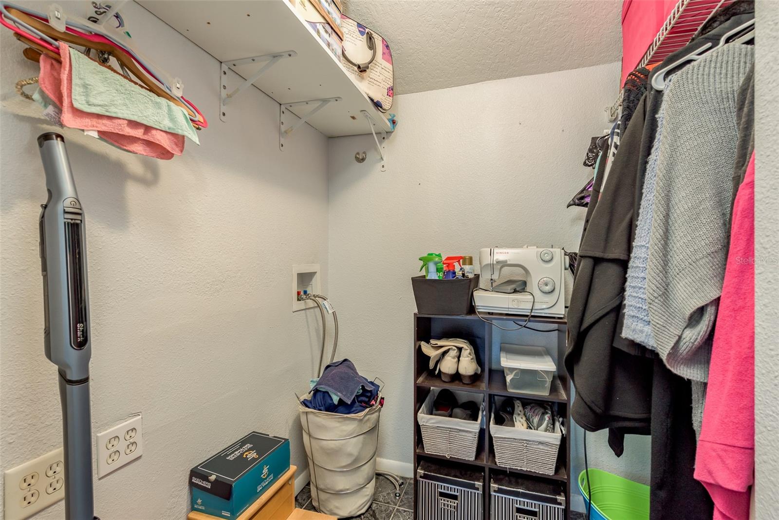 walk-in closet in 2nd bedroom has a washer and dryer hookup