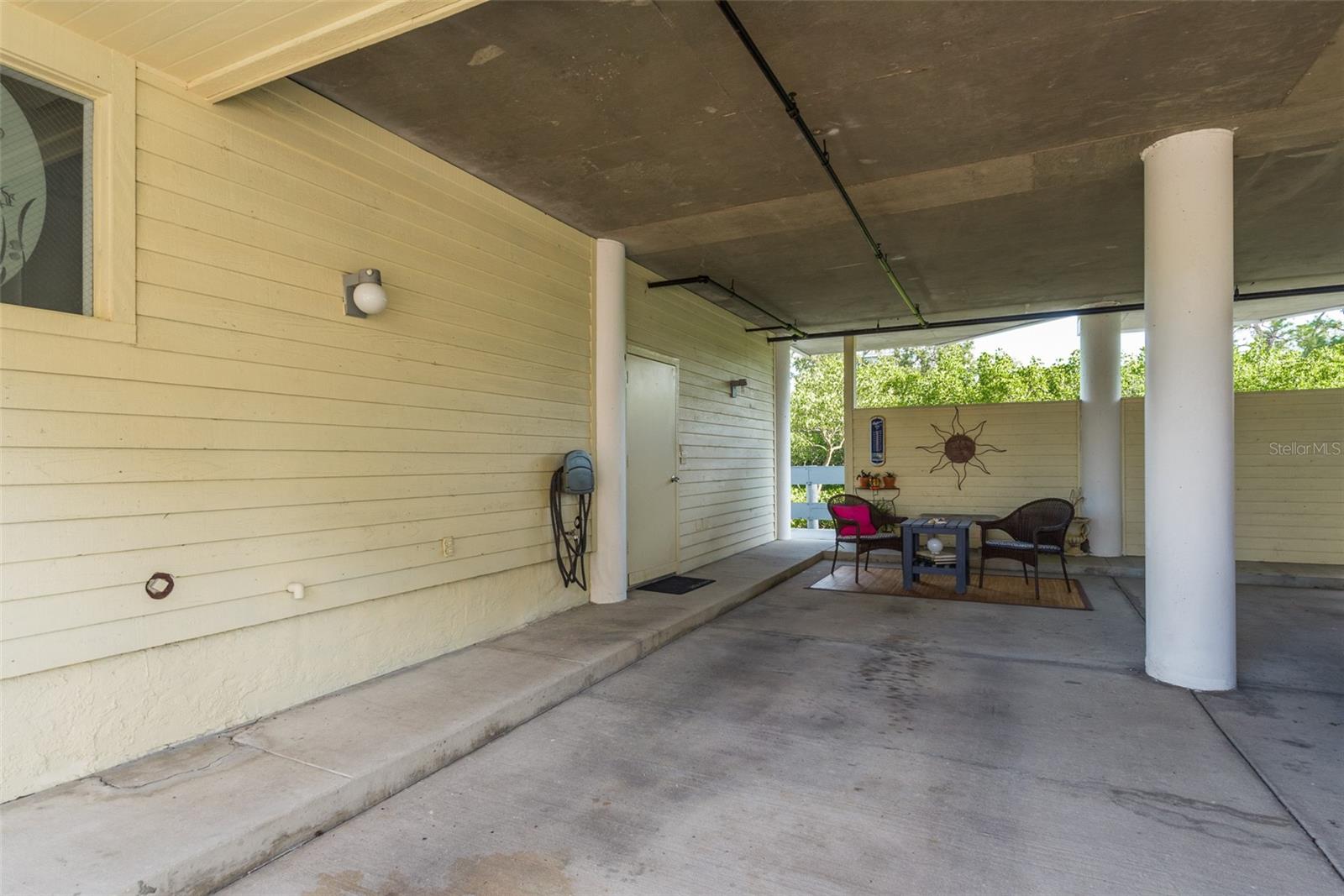 long carport could hold two cars or room for boats and outdoor gear.