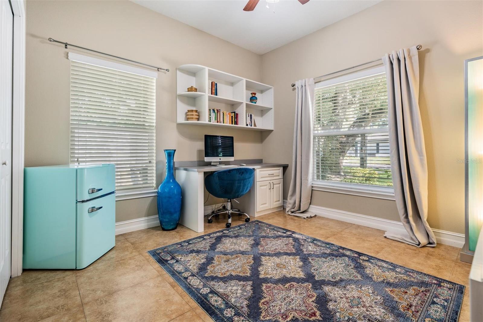 bedroom 3 with custom built-in closet and built-in desk