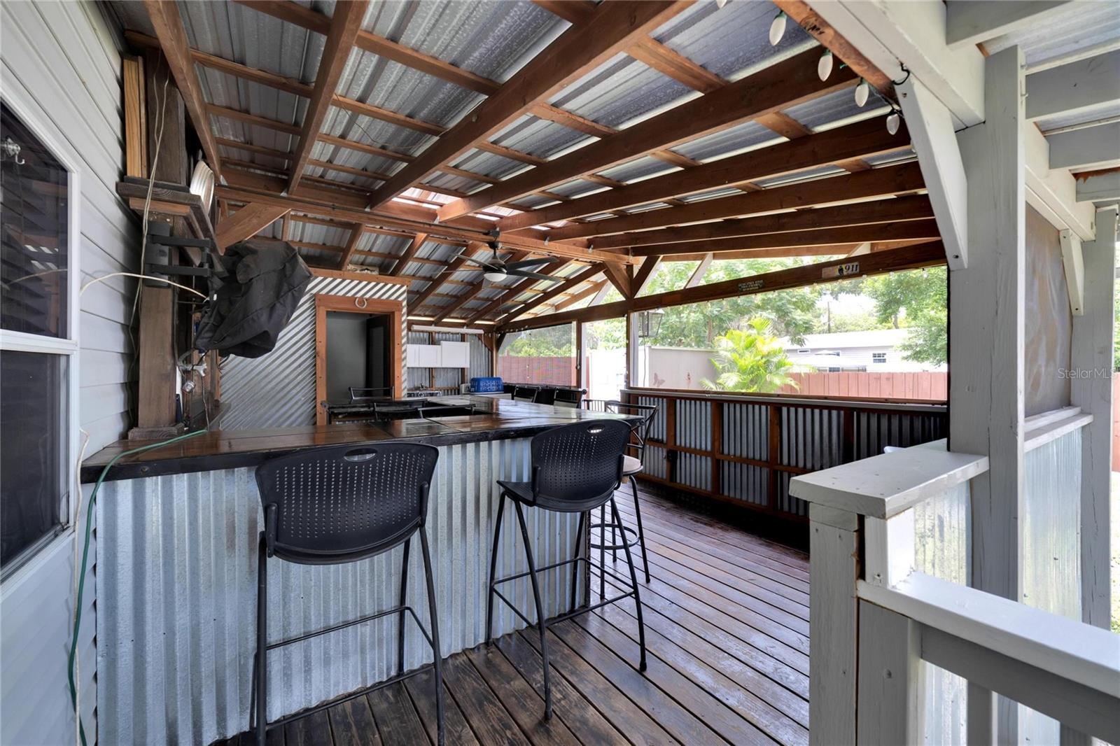 Wrap-around porch and outdoor bar