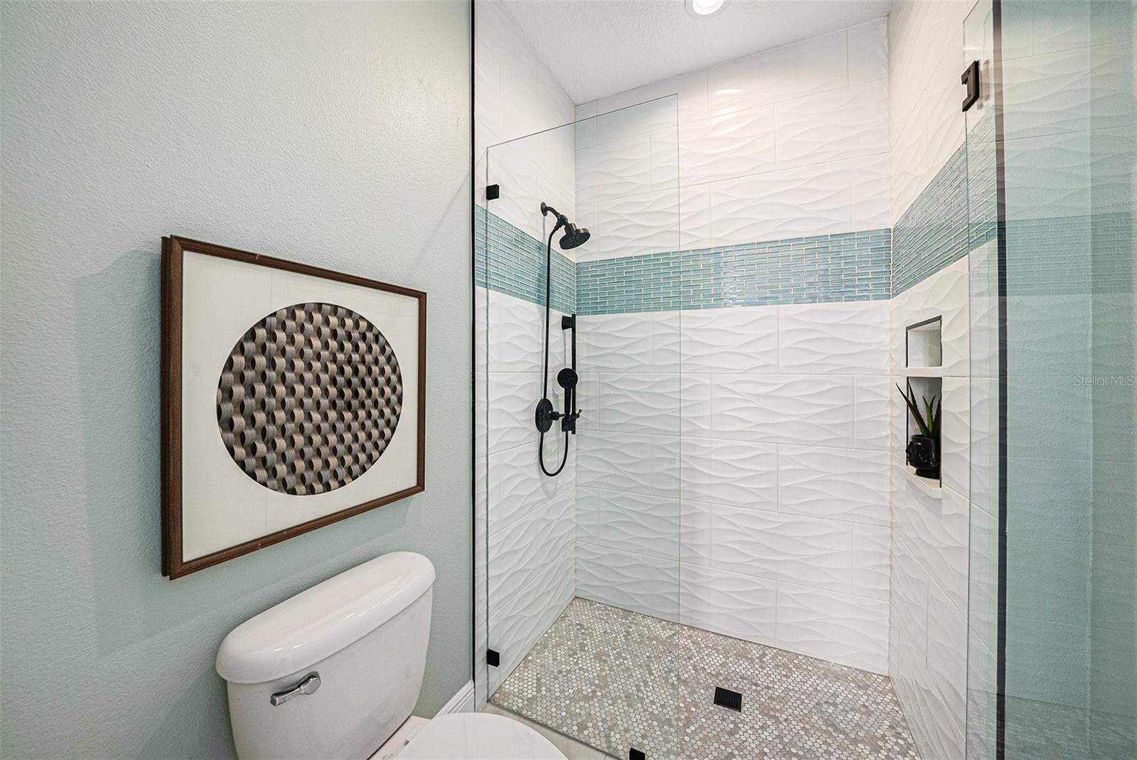 Walk in shower with frame less shower doors