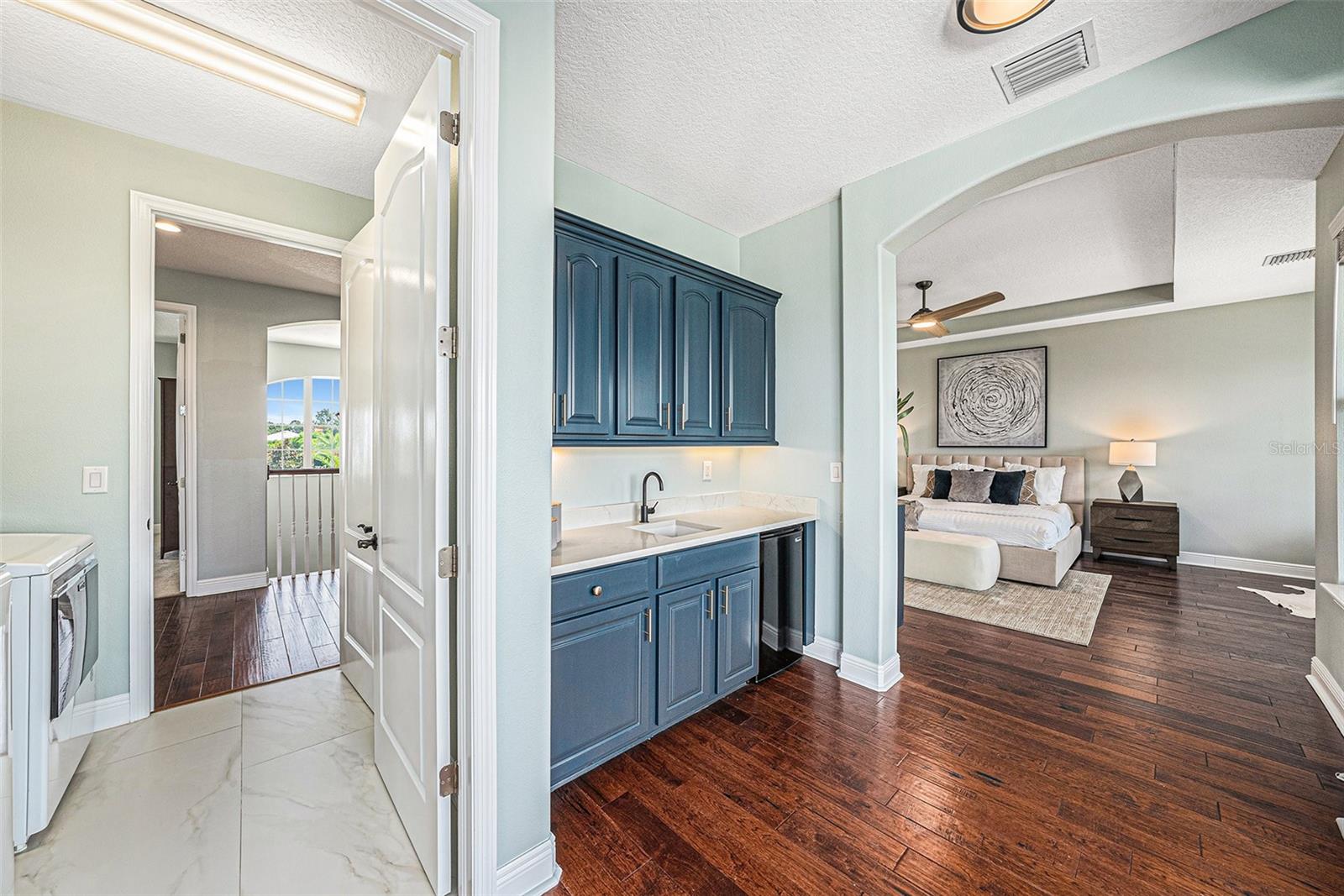 Main bedroom with wet bar for coffee and mini-fridge. Oversized Lanai is across from the wet bar.