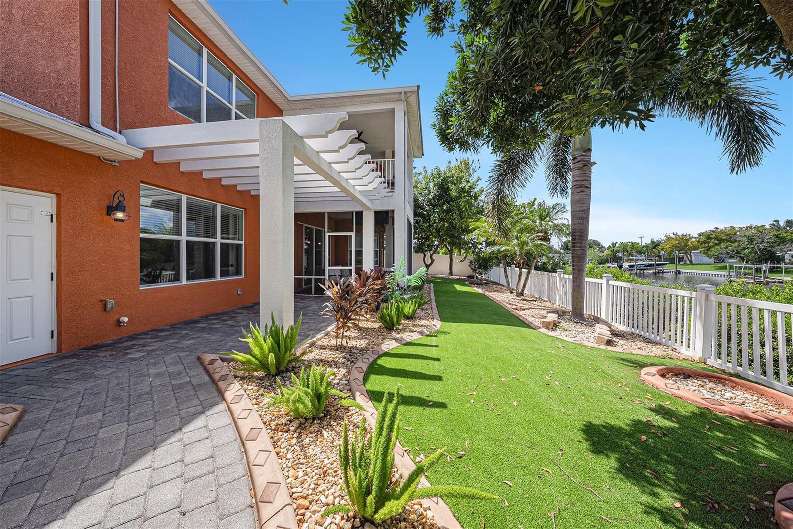 Xeriscaped landscaping with artificial turf in the backyard. You'll also find Avocado, Loquat and Lime trees on the property.