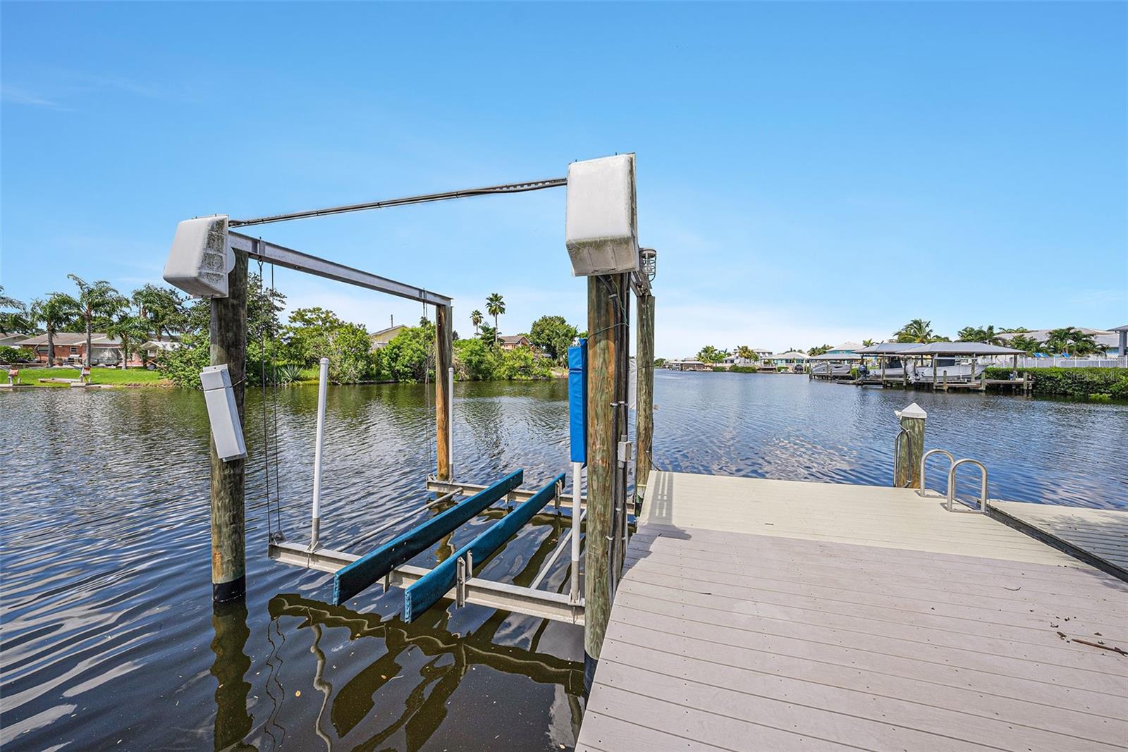 10,000 lb boat lift with concrete and vinyl planks with floating dock