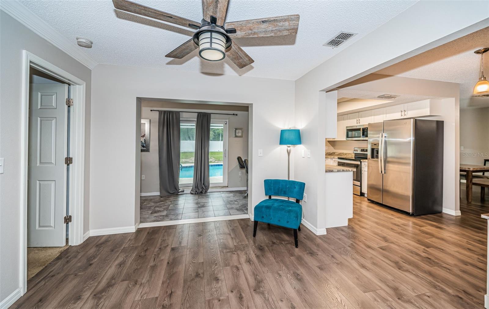 DINING ROOM AREA WTH BONUS ROOM IN BACK GROUND