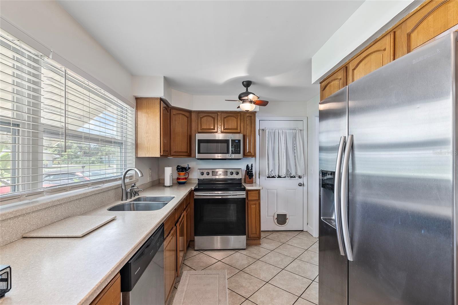 Alternate view of the kitchen.  Door to the right of the oven leads to the attached one-car garage